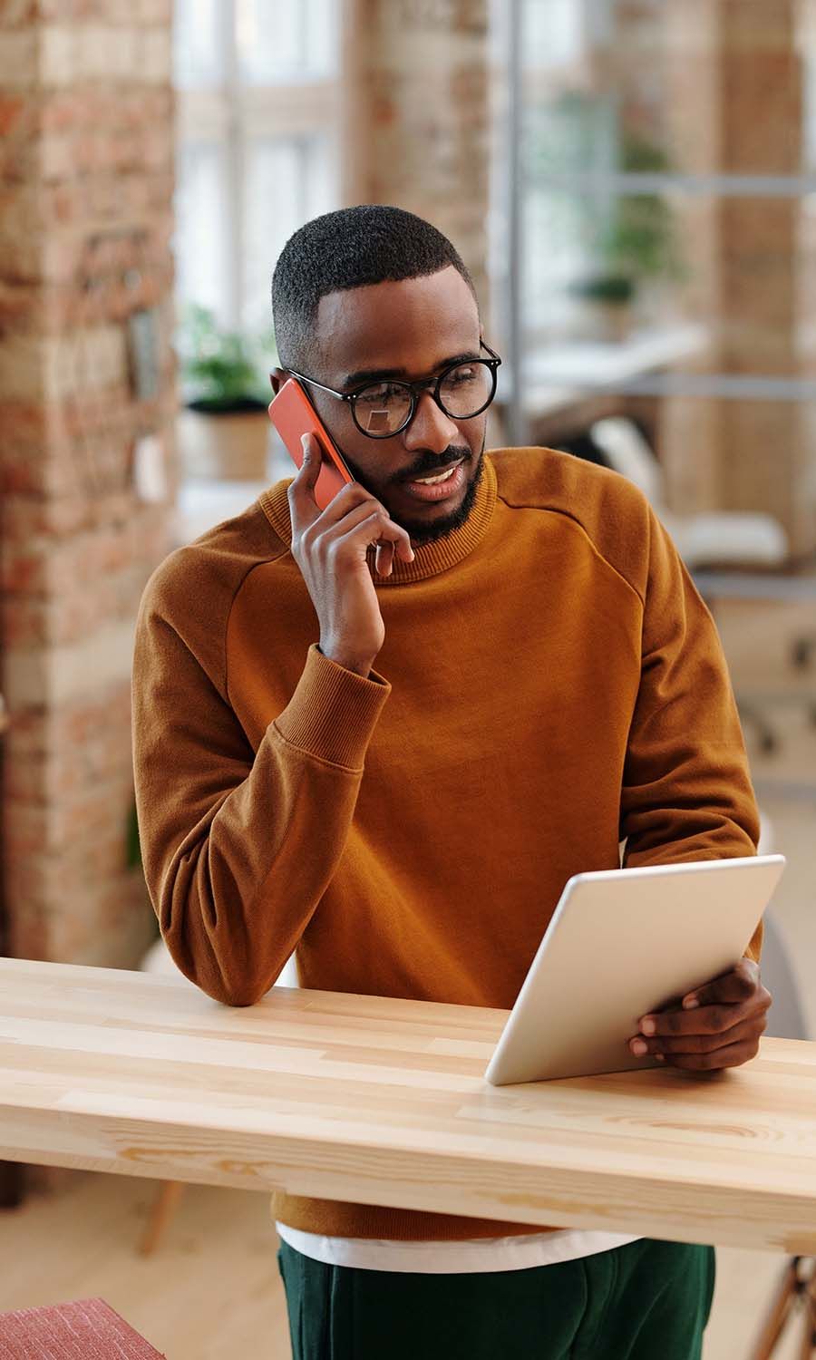 Man plugging wifi into wall